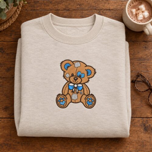 Diseño de bordado de osito de peluche con parches, bordado en una sudadera de cuello redondo
