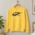 Diseño bordado "Jesus Did It Swoosh" bordado en la parte delantera de una sudadera de cuello redondo.
