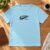 Diseño de bordado "Jesus Did It Swoosh" bordado en una camiseta.
