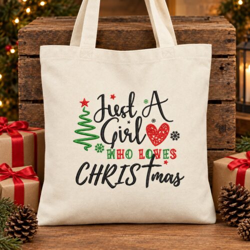 Diseño de bordado "Just a Girl Who Loves Christmas" bordado en un bolso de mano.