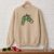 Diseño de bordado de las manos del Grinch navideño fumando, bordado en una sudadera de cuello redondo.