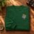 Tiger King embroidery design stitched as a left-chest logo on a crewneck sweatshirt