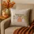 Welcome Fall Script with Pumpkins Embroidery Design on pillow