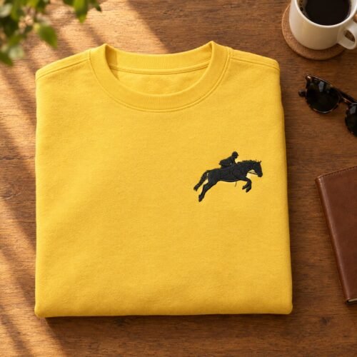 Horse Jumping Silhouette embroidery design stitched as a left-chest logo on a crewneck sweatshirt