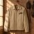 Horse Jumping Silhouette embroidery design stitched as a left-chest logo on a work jacket