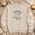 Spooky Season Ghost embroidery design stitched on a crewneck sweatshirt