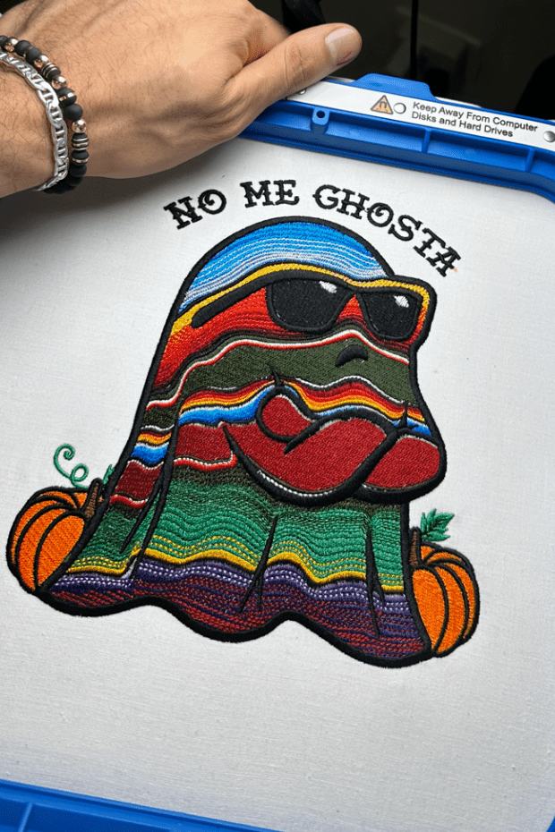 No Me Ghosta Halloween design stitched out, still hooped