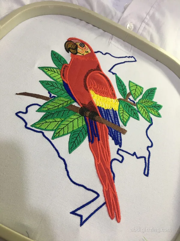 Colombia map outline with a parrot in applique embroidery design