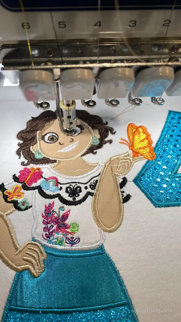 Applique embroidery design of mirabel character from encanto movie