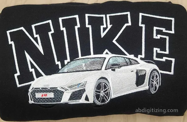 NIKE words with an audi car in front of the words as machine embroidery design
