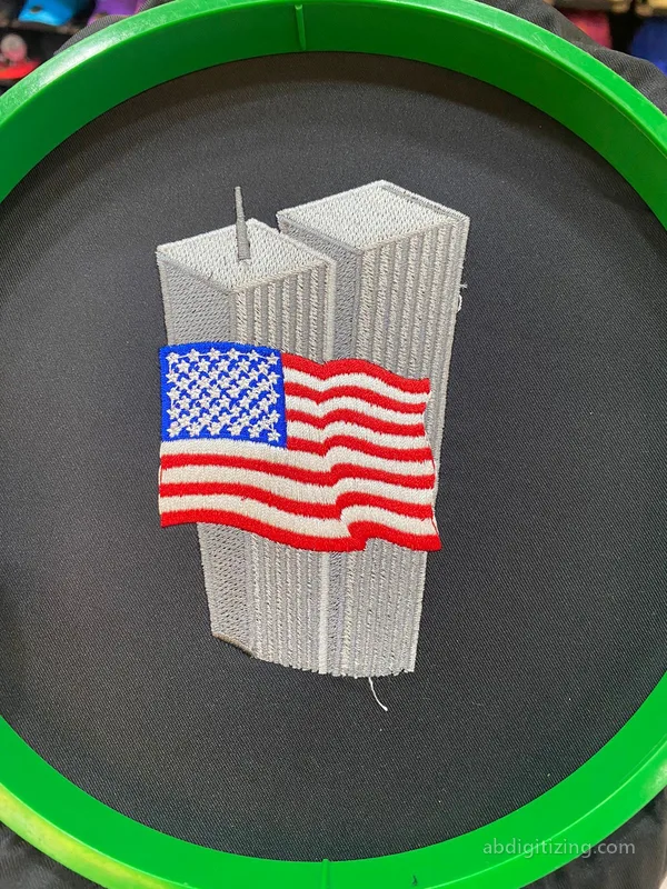 Twin towers with United states flag in front of it